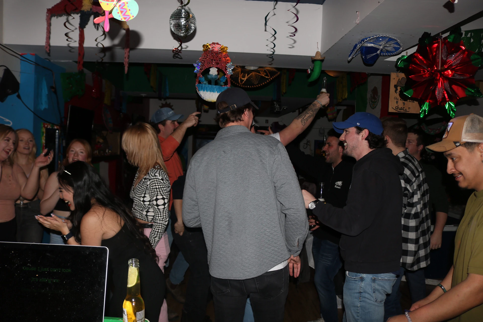 A crowd dancing and enjoying a music night at Hacienda Santa Teresa
