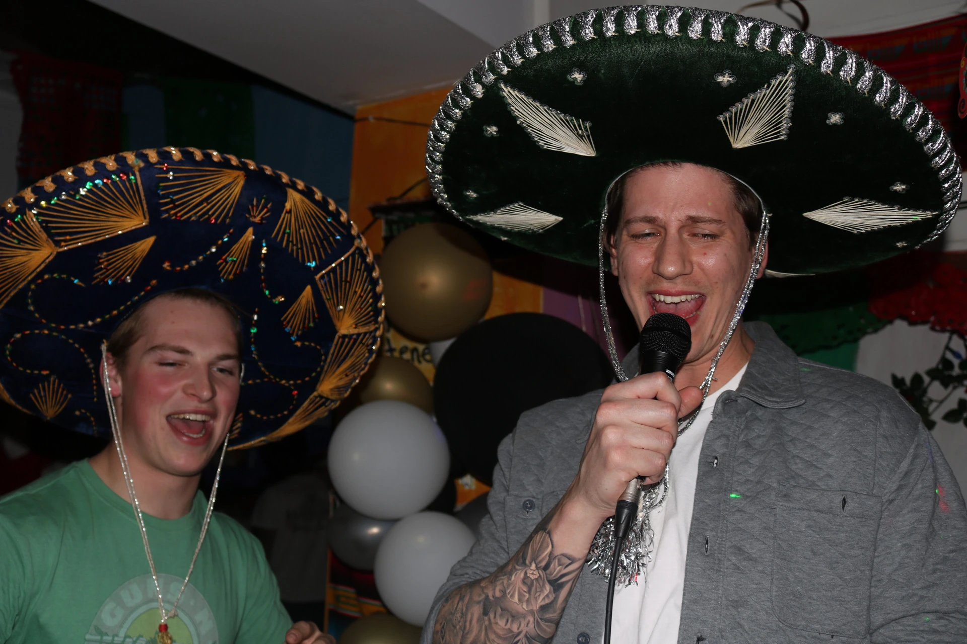 Guests in sombreros singing karaoke at Hacienda Santa Teresa