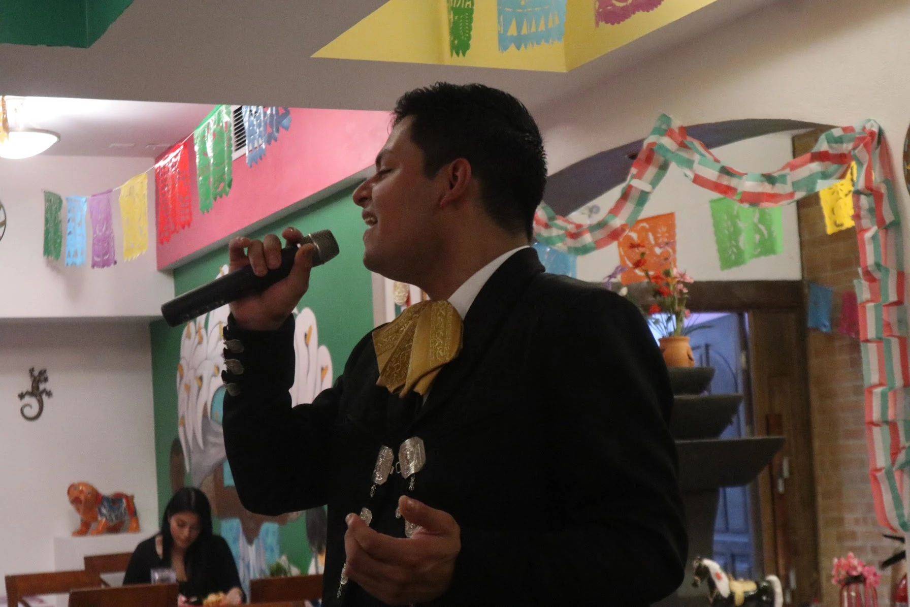A mariachi singer performing inside Hacienda Santa Teresa