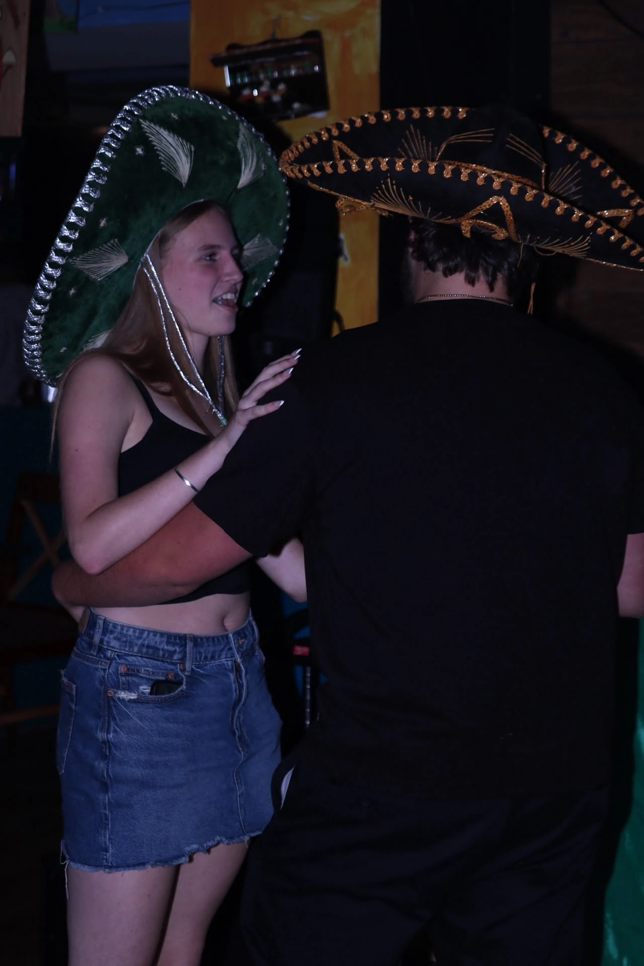 Guests wearing sombreros and dancing at Hacienda Santa Teresa