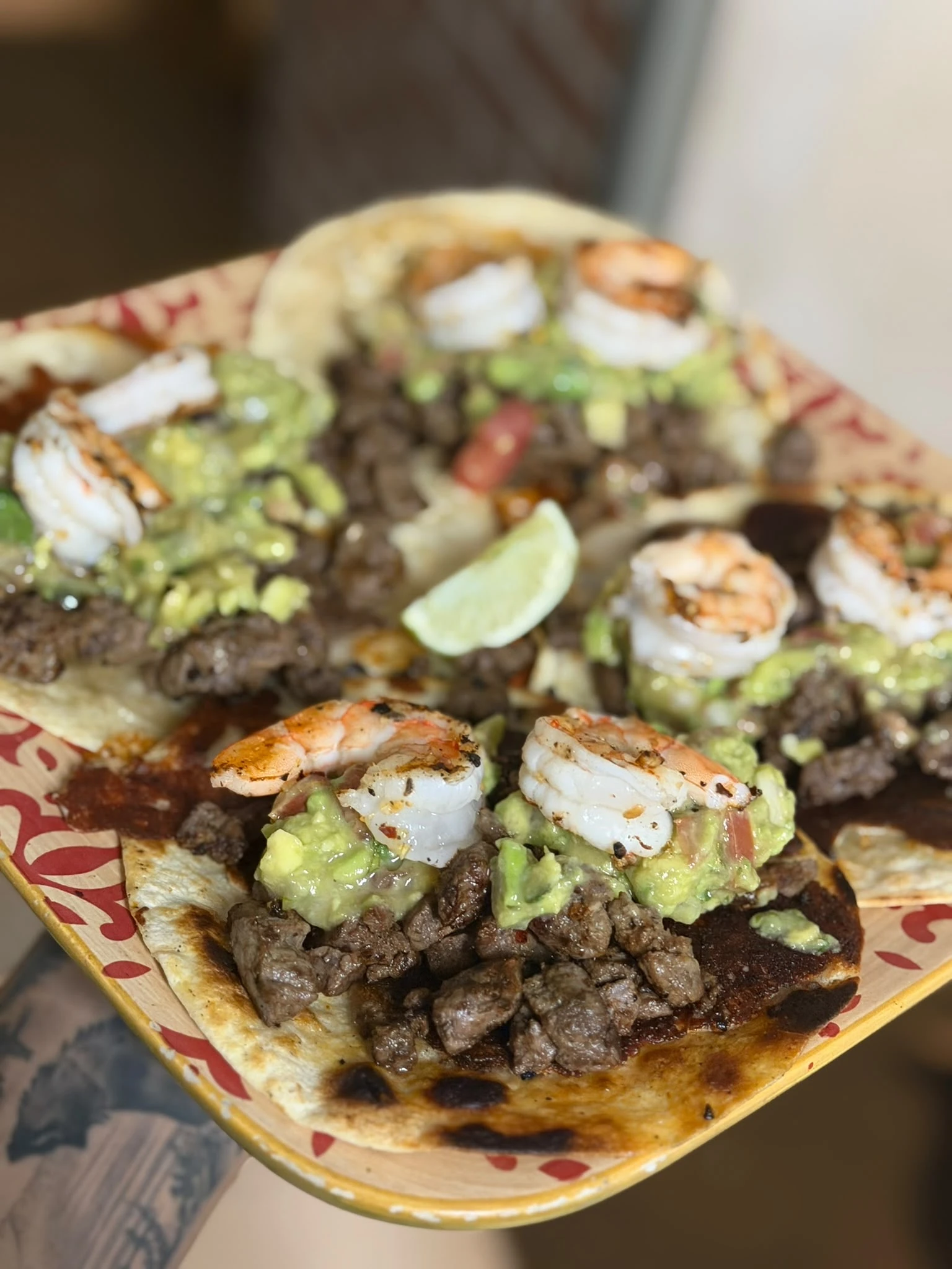 Steak, shrimp, and guacamole on grilled tortillas at Hacienda Santa Teresa