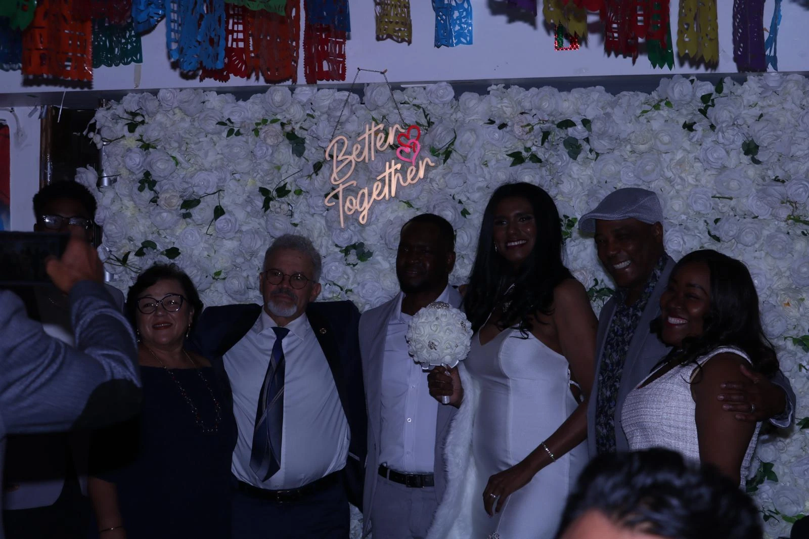 A wedding couple and their guests posing together at Hacienda Santa Teresa