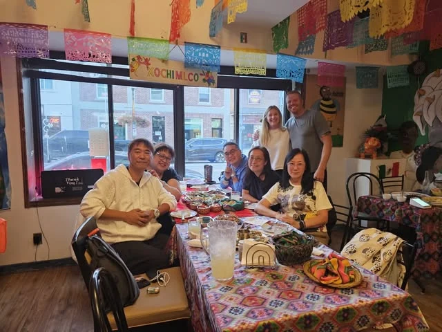 Guests gathered around a colourful table in Hacienda Santa Teresa’s dining room